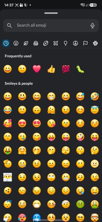 This image shows an emoji keyboard interface on a mobile device, displaying a comprehensive collection of emoticons and smiley faces. The interface features a
